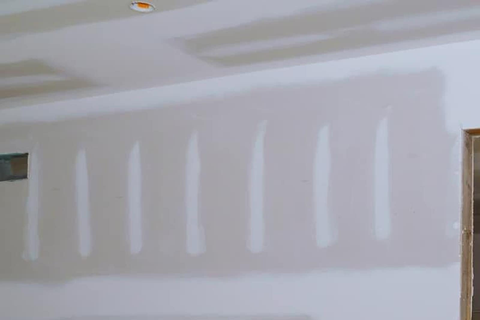 Interior ceiling and taped seams, where a roof leak first shows as a stain